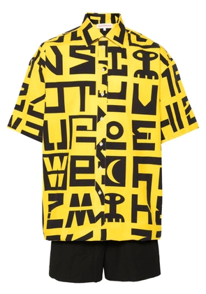 Walter Van Beirendonck logo-print cotton jumpsuit - Yellow