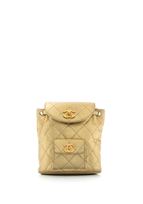 CHANEL Pre-Owned 1991-1994 metallic flap drawstring backpack - Gold