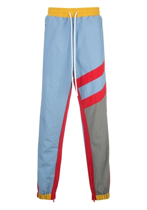 God's Masterful Children striped track trousers - Blue
