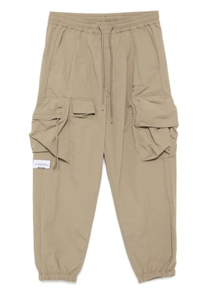 Musium Div. logo-embroidered cargo trousers - Neutrals