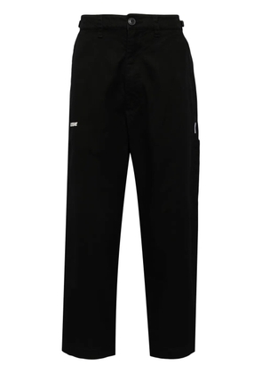 izzue logo-embroidered casual trousers - Black