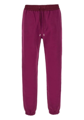 Saint Laurent embroidered-logo cotton track pants - Purple