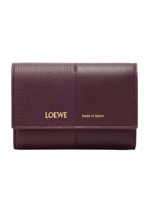 Small vertical wallet in smooth and grained calfskin