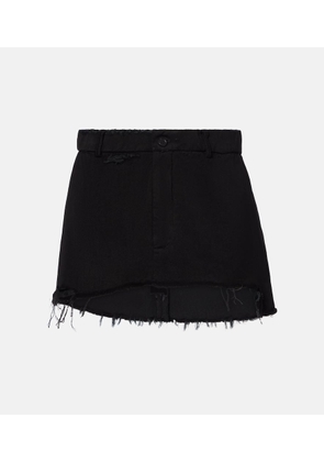 Balenciaga Distressed denim miniskirt