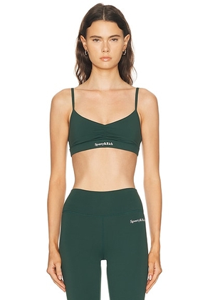 Sporty & Rich Serif Logo Mini Sports Bra in Forest - Dark Green. Size L (also in M, S, XS).