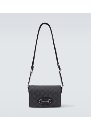 Gucci GG Supreme leather-trimmed canvas crossbody bag