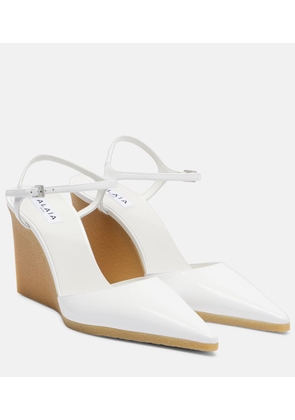 Alaia 90 patent leather wedge slingback pumps