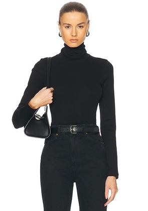 FLORE FLORE Dinah Turtleneck Top in Black - Black. Size L (also in ).