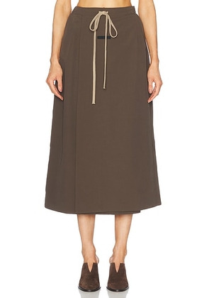 Fear of God ESSENTIALS Military Nylon Wrap Skirt in Brown - Brown. Size XS (also in ).