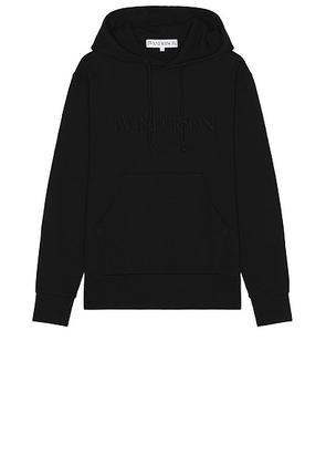 JW Anderson Logo Embroidery Hoodie in Black - Black. Size L (also in M, S, XL/1X).