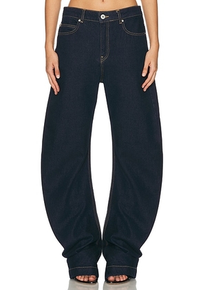 HAELO Banana Twist Flare Jean in Indigo - Blue. Size 23 (also in 24, 25, 26, 27, 32).