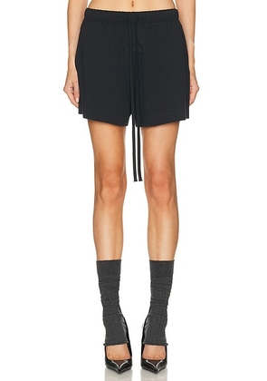 Fear of God ESSENTIALS Soccer Short in Jet Black - Black. Size L (also in S).