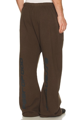 Fear of God ESSENTIALS Flare Sweatpant in Brown - Brown. Size L (also in M, S, XL/1X, XS, XXL/2X).