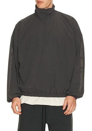Fear of God ESSENTIALS Half Zip Track Jacket in Iron Grey - Grey. Size L (also in M, S, XL/1X).