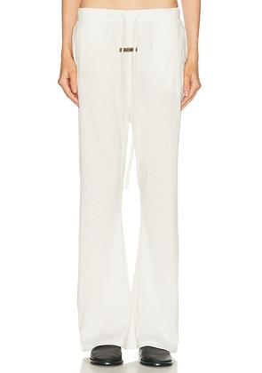 Fear of God ESSENTIALS Flare Pant in Ivory - Ivory. Size L (also in M, S, XL, XS, XXS).