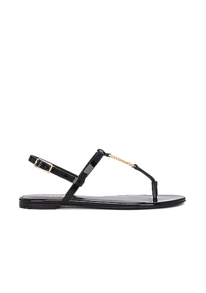 Saint Laurent Cassandra Flat Sandal in Noir - Black. Size 36 (also in 36.5, 37, 37.5, 38, 38.5, 39, 39.5, 40, 40.5, 41).