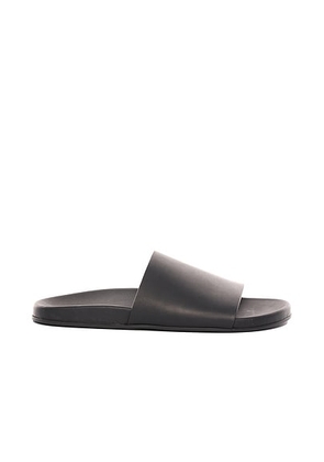 The Row Hugh Slide in Black - Black. Size 36 (also in 37, 38, 39, 40, 41, 42).