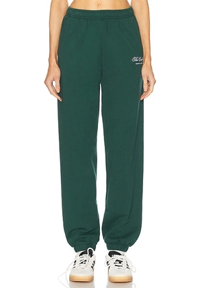 Sporty & Rich X Hotel Carlyle Script Embroidered Sweatpant in Forest - Dark Green. Size XL (also in ).