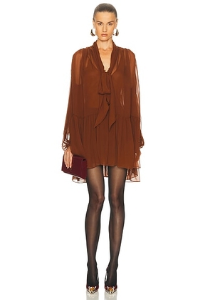 Saint Laurent Sheer Long Sleeve Mini Dress in Rouille - Rust. Size 34 (also in 36).