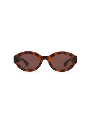 Gucci Oval Sunglasses in Brown.