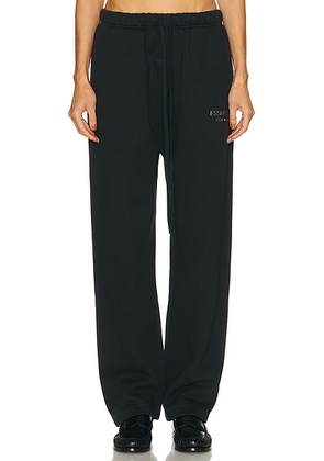 Fear of God ESSENTIALS Fleece Relaxed Sweatpant in Jet Black - Black. Size S (also in ).