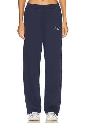 Sporty & Rich Syracuse Wide Sweatpant in Dark Navy - Navy. Size L (also in M, S, XL, XS).