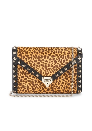 Valentino Garavani Rockstud Calf Hair Mini Bag in Biscotto Bark Brown & Nero - Brown. Size all.