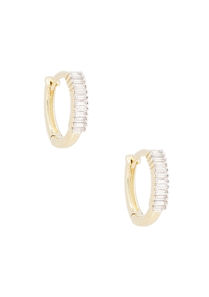STONE AND STRAND Up and Down Baguette Diamond Huggie Earrings in Metallic Gold.
