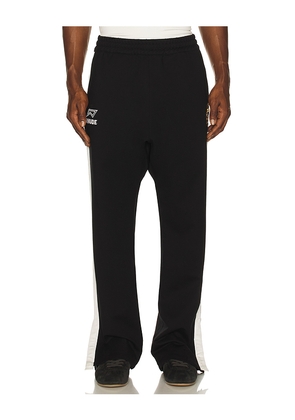 Rhude Lago Hamptons Track Pant in Black. Size L. Also in M, XL/1X, XXL/2X.
