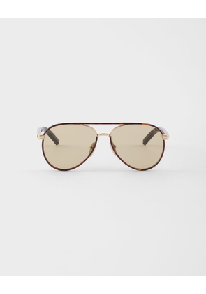 Prada sunglasses with the iconic metal plaque