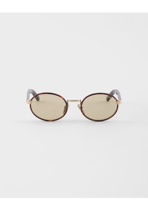 Prada sunglasses with the iconic metal plaque