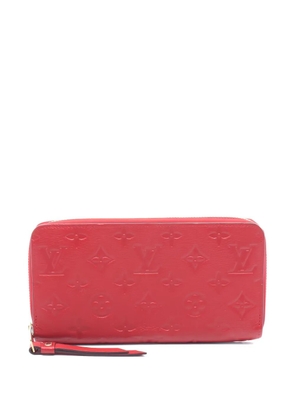 Louis Vuitton Pre-Owned debossed-monogram zip-around wallet - Red