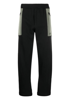 Alexander McQueen contrast-pocket cotton track pants - Black