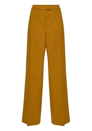 La DoubleJ pressed-crease flared trousers - Yellow