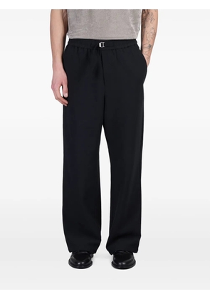 AMI Paris logo-buckled trousers - Black