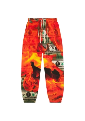 Denim Tears Burn It All printed track pants - Orange