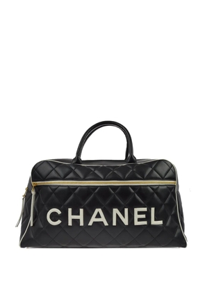 CHANEL Pre-Owned 1995 logo patch travel bag - Black