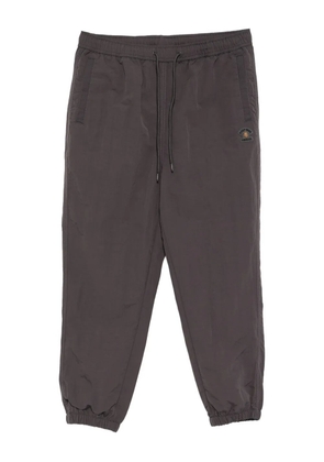 FINGERCROXX logo-patch trousers - Grey