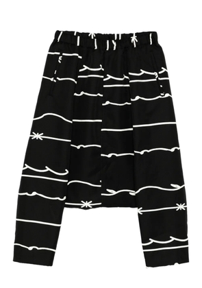 Black Comme Des Garçons print trousers