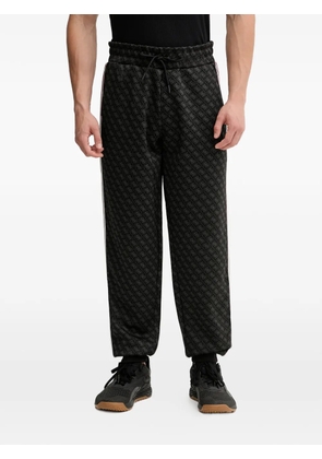 GUESS USA pattern side stripe track pants - Black