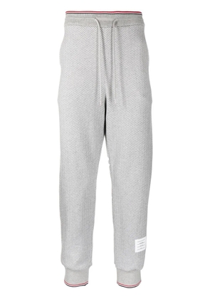 Thom Browne herringbone-pattern logo-patch track pants - Grey
