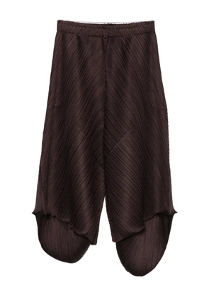 Pleats Please Issey Miyake pleated panelled trousers - Brown
