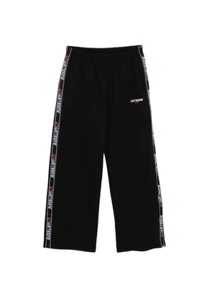 We11done logo-tape trousers - Black