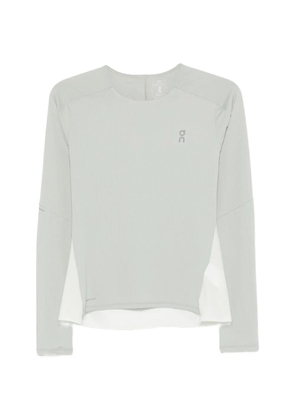 On long-sleeve performance top - Green
