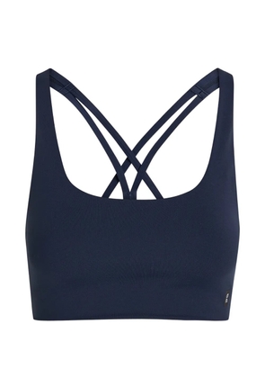 On blue sports bra