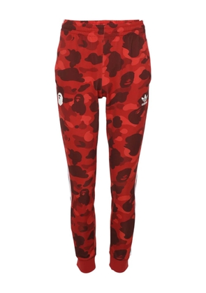 A BATHING APE® X Adidas camouflage-print track pants - Red