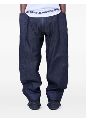 Walter Van Beirendonck embossed-detail jeans - Blue