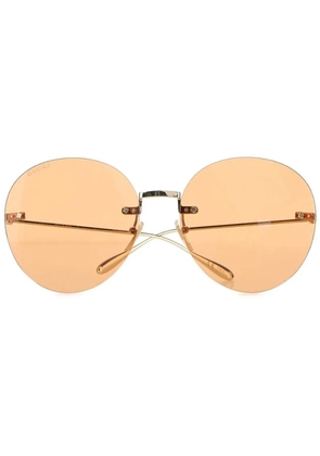 Gucci Eyewear round-frame logo-charm sunglasses - Gold