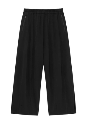 FFFPOSTALSERVICE zip-pockets trousers - Black
