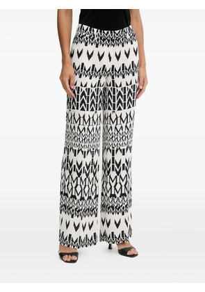 MARCIANO by GUESS logo-pattern trousers - White